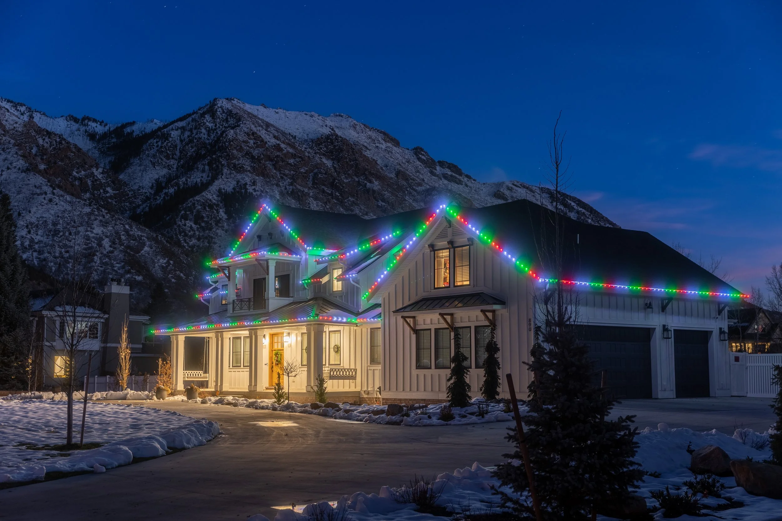 Home professionally decorated with warm white Christmas lights