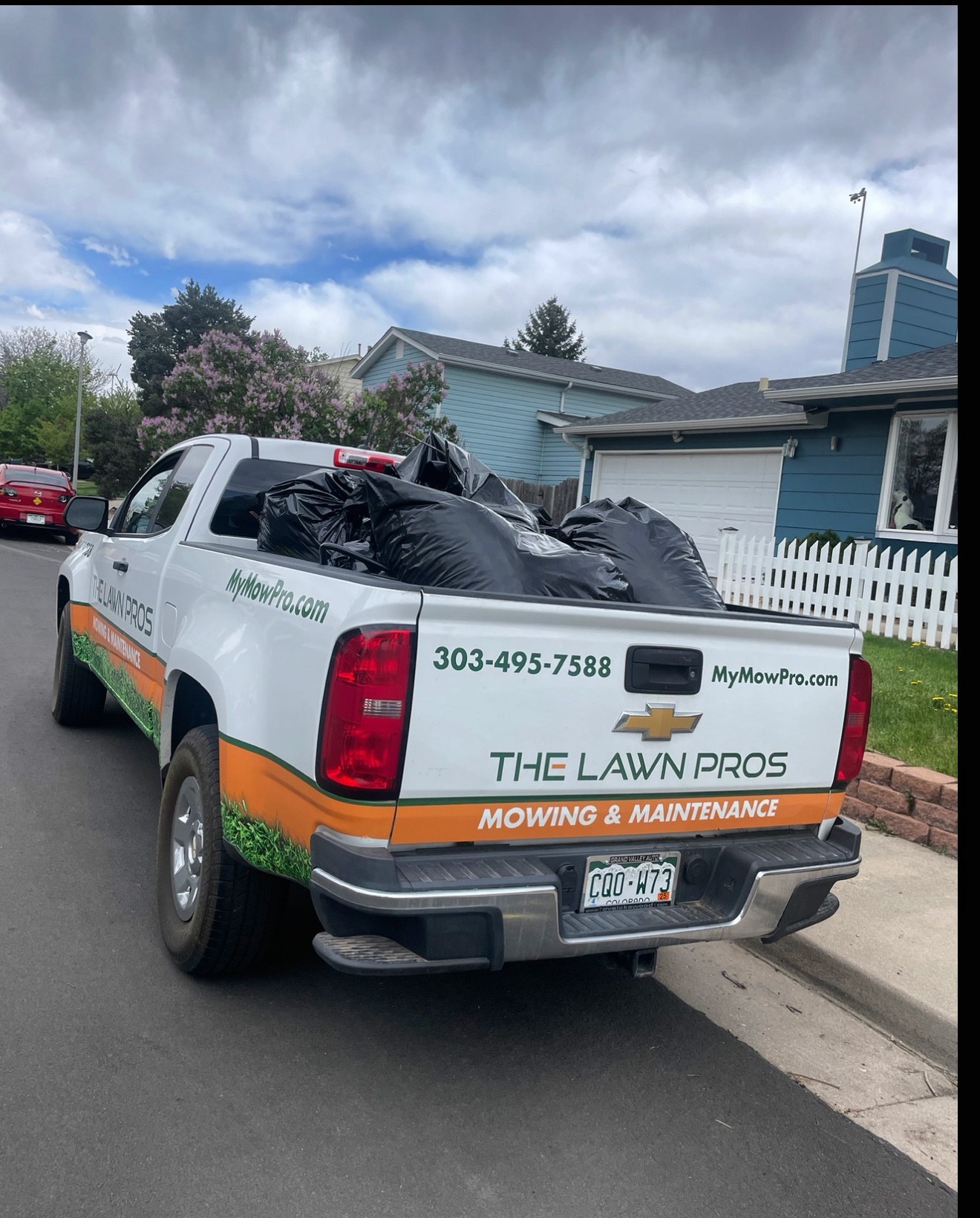 The Lawn Pros branded work truck at a Denver Metro property